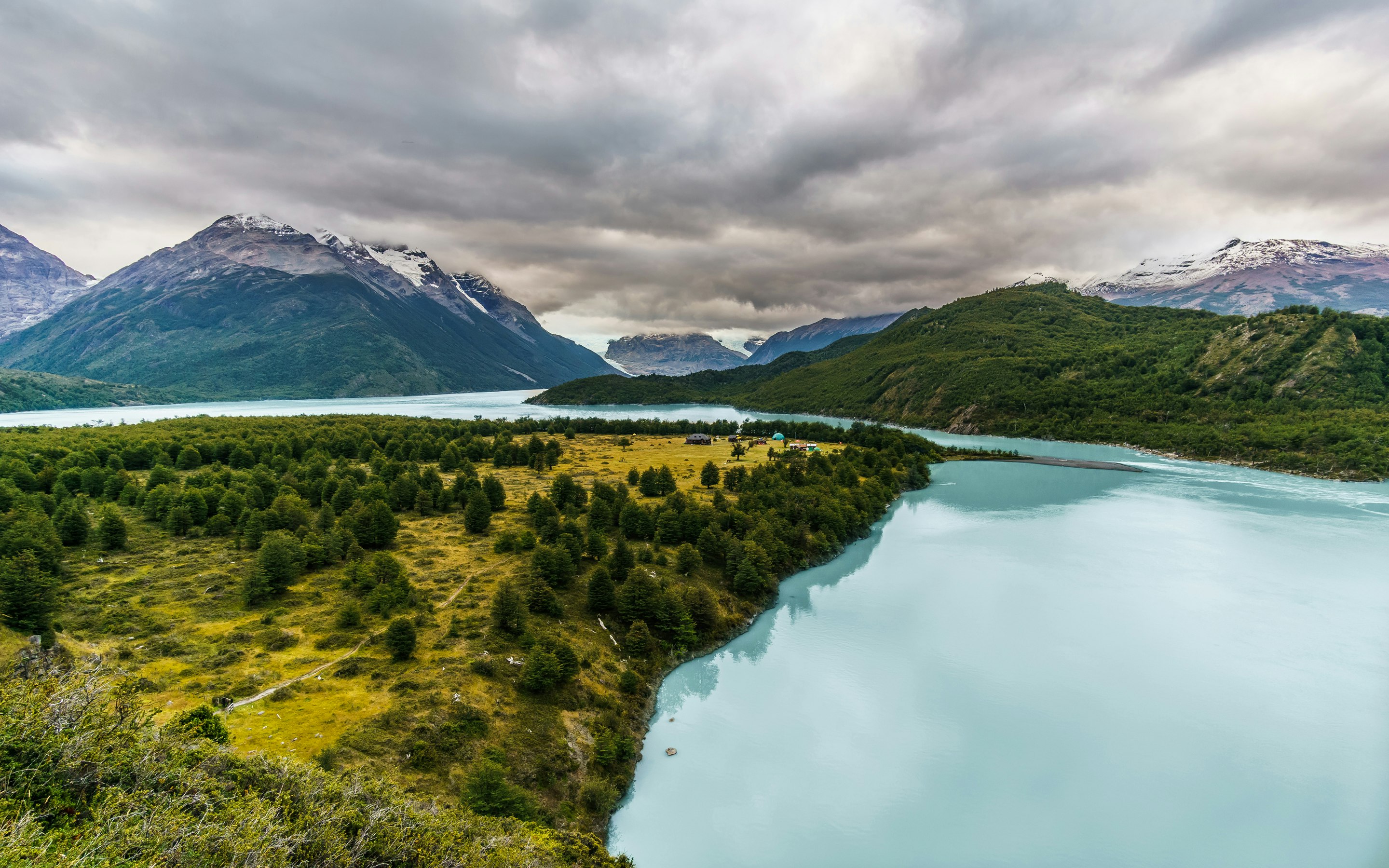 overlooking mountain and calm body of water